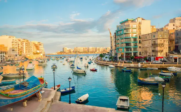 beautiful view of harbor with maltese yachts and boats in St. Julians to Sliema, Spinola Bay, Malta